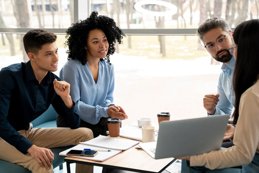 Business owners talking with M&A advisors.