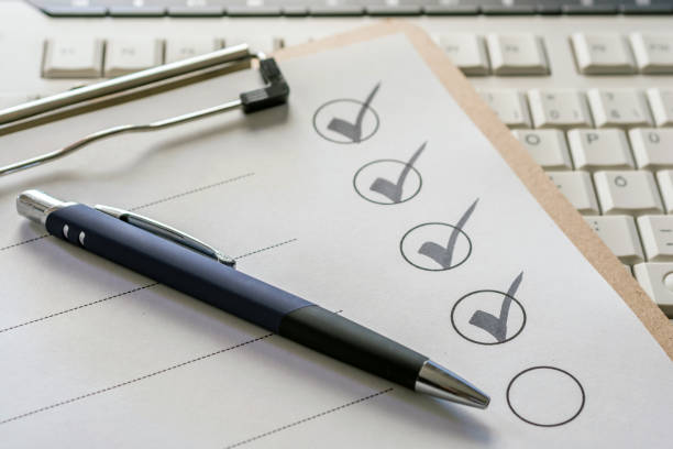 A checklist with a pen on a clipboard.